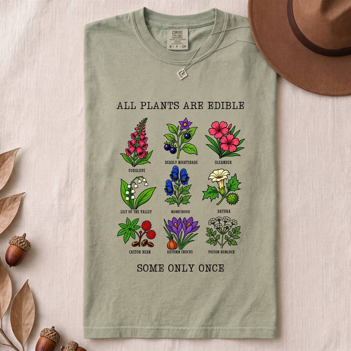 All Plants Are Edible Some Only Once Botanical Chart T-Shirt - Bay folded t-shirt mockup