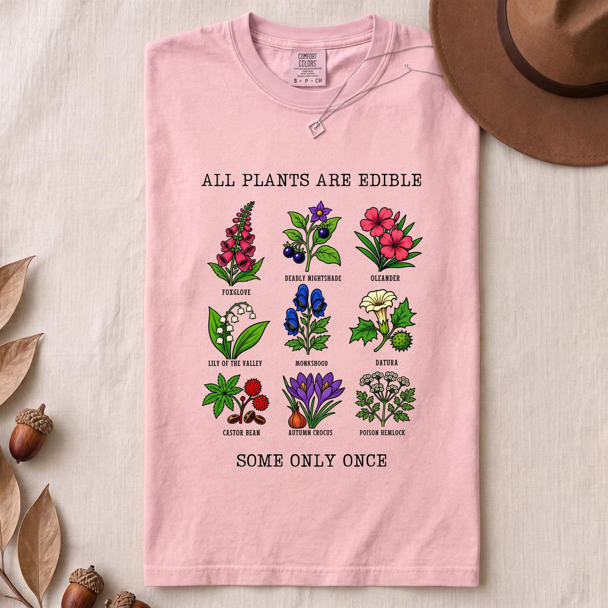 All Plants Are Edible Some Only Once Botanical Chart T-Shirt - Blossom folded t-shirt mockup