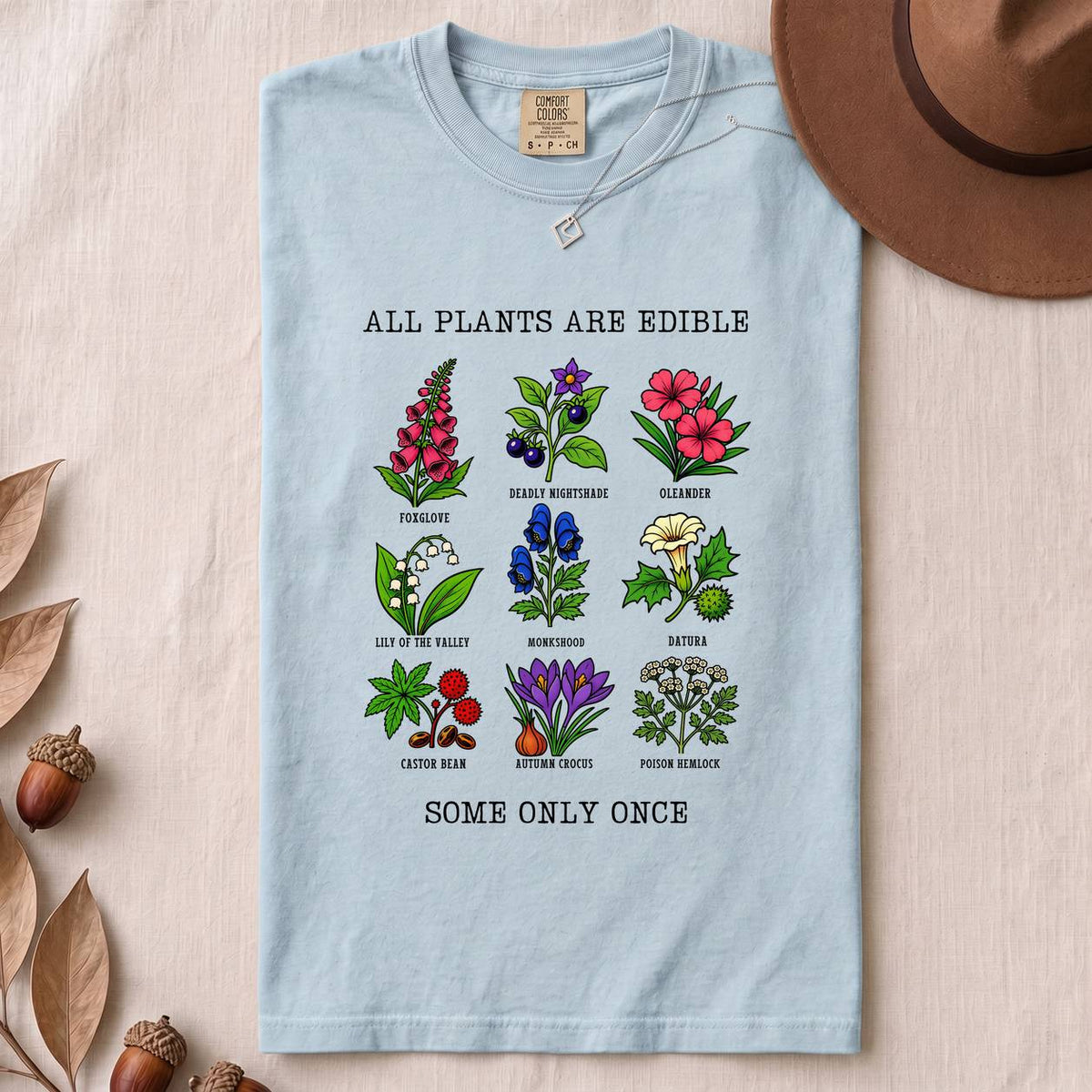 All Plants Are Edible Some Only Once Botanical Chart T-Shirt - Chambray folded t-shirt mockup