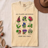 All Plants Are Edible Some Only Once Botanical Chart T-Shirt - Ivory folded t-shirt mockup