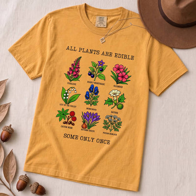 All Plants Are Edible Some Only Once Botanical Chart T-Shirt - Mustard unfolded t-shirt mockup