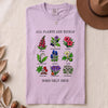 All Plants Are Edible Some Only Once Botanical Chart T-Shirt - Orchid folded t-shirt mockup