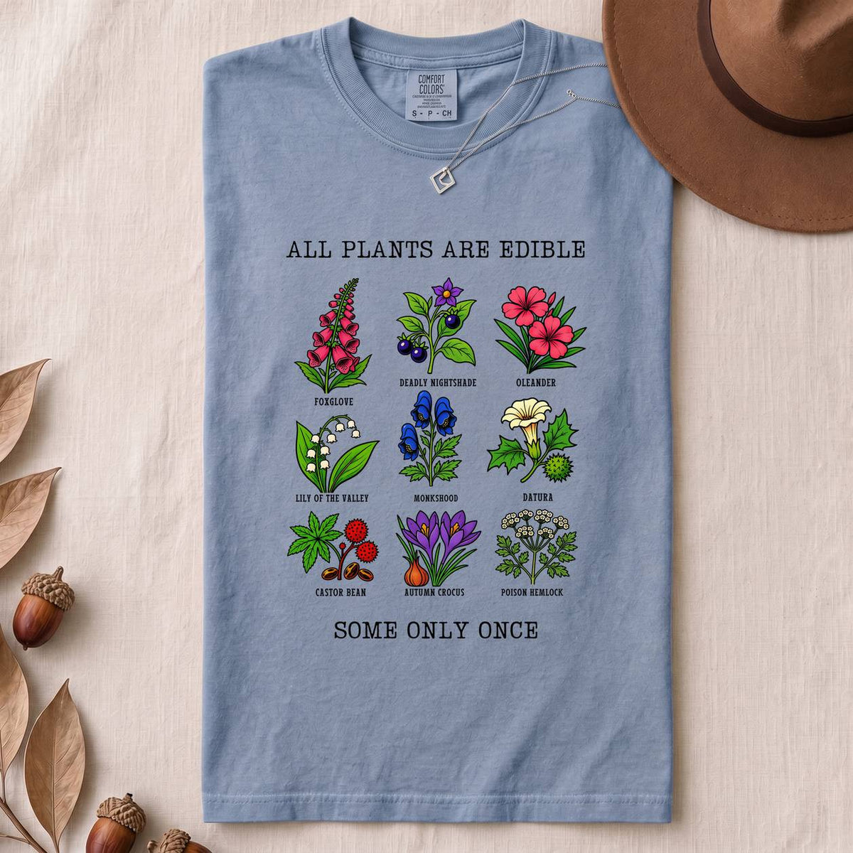 All Plants Are Edible Some Only Once Botanical Chart T-Shirt - Washed Denim folded t-shirt mockup