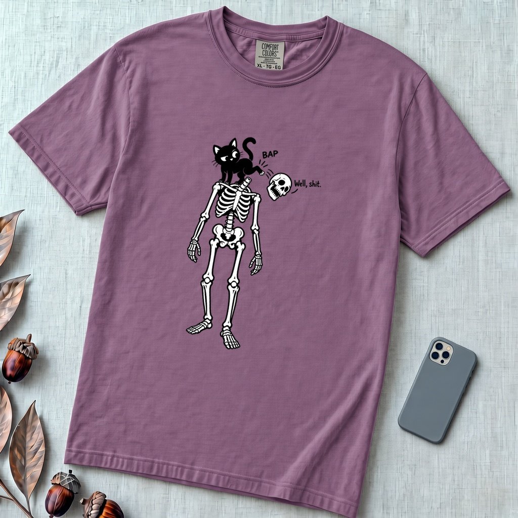 Cat Knocks Skull Off Graphic Tee, Black Cat vs Skeleton Funny T-Shirt - Berry unfolded t-shirt mockup