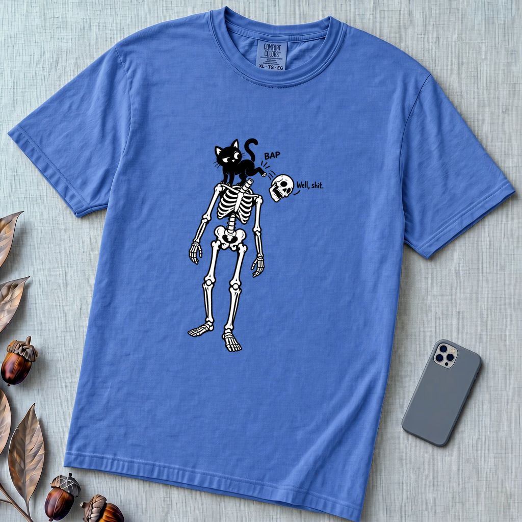 Cat Knocks Skull Off Graphic Tee, Black Cat vs Skeleton Funny T-Shirt - Flo Blue unfolded t-shirt mockup