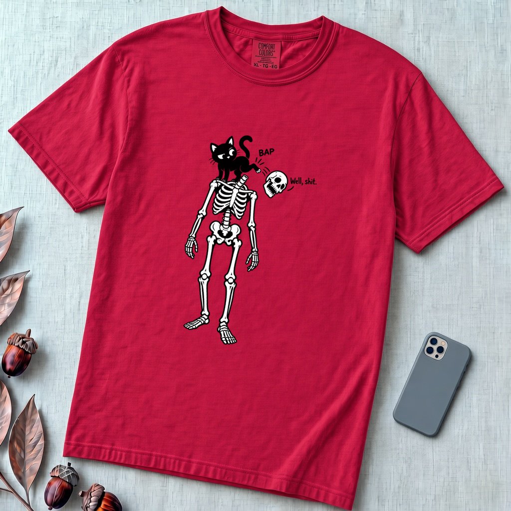 Cat Knocks Skull Off Graphic Tee, Black Cat vs Skeleton Funny T-Shirt - Red unfolded t-shirt mockup