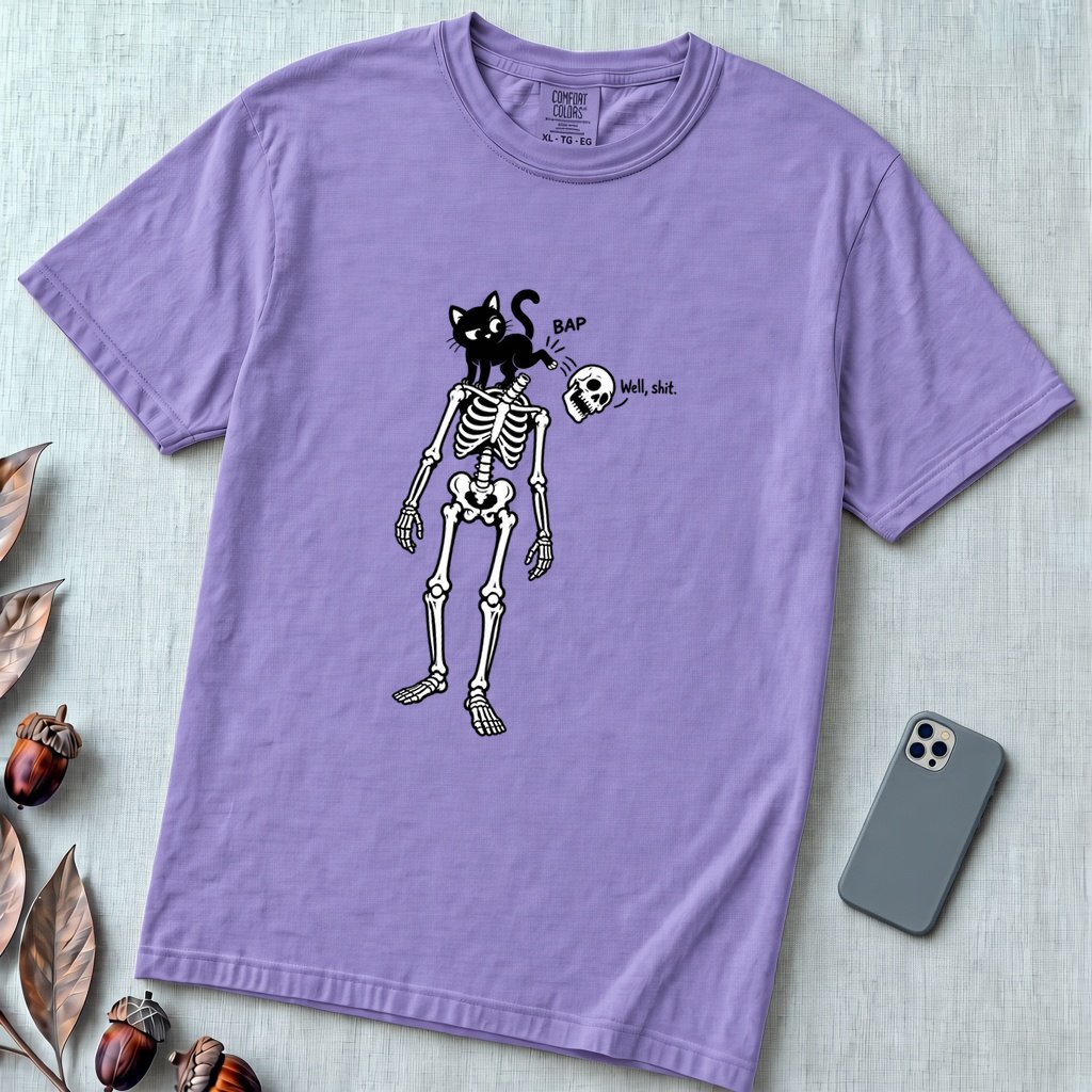 Cat Knocks Skull Off Graphic Tee, Black Cat vs Skeleton Funny T-Shirt - Violet unfolded t-shirt mockup