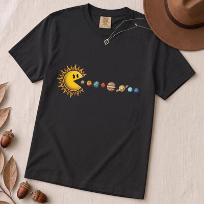 Cosmic Appetite - Sun Pac-Man Eating Planets - Unisex garment-dyed heavyweight t-shirt - Black unfolded t-shirt mockup