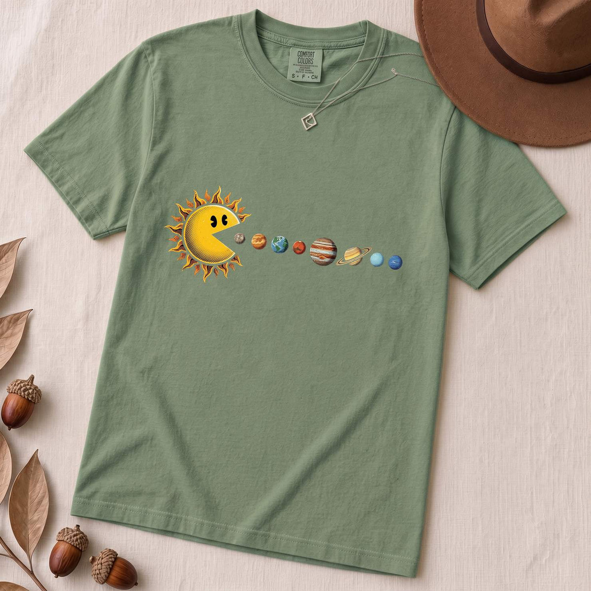 Cosmic Appetite - Sun Pac-Man Eating Planets - Unisex garment-dyed heavyweight t-shirt - Light Green unfolded t-shirt mockup