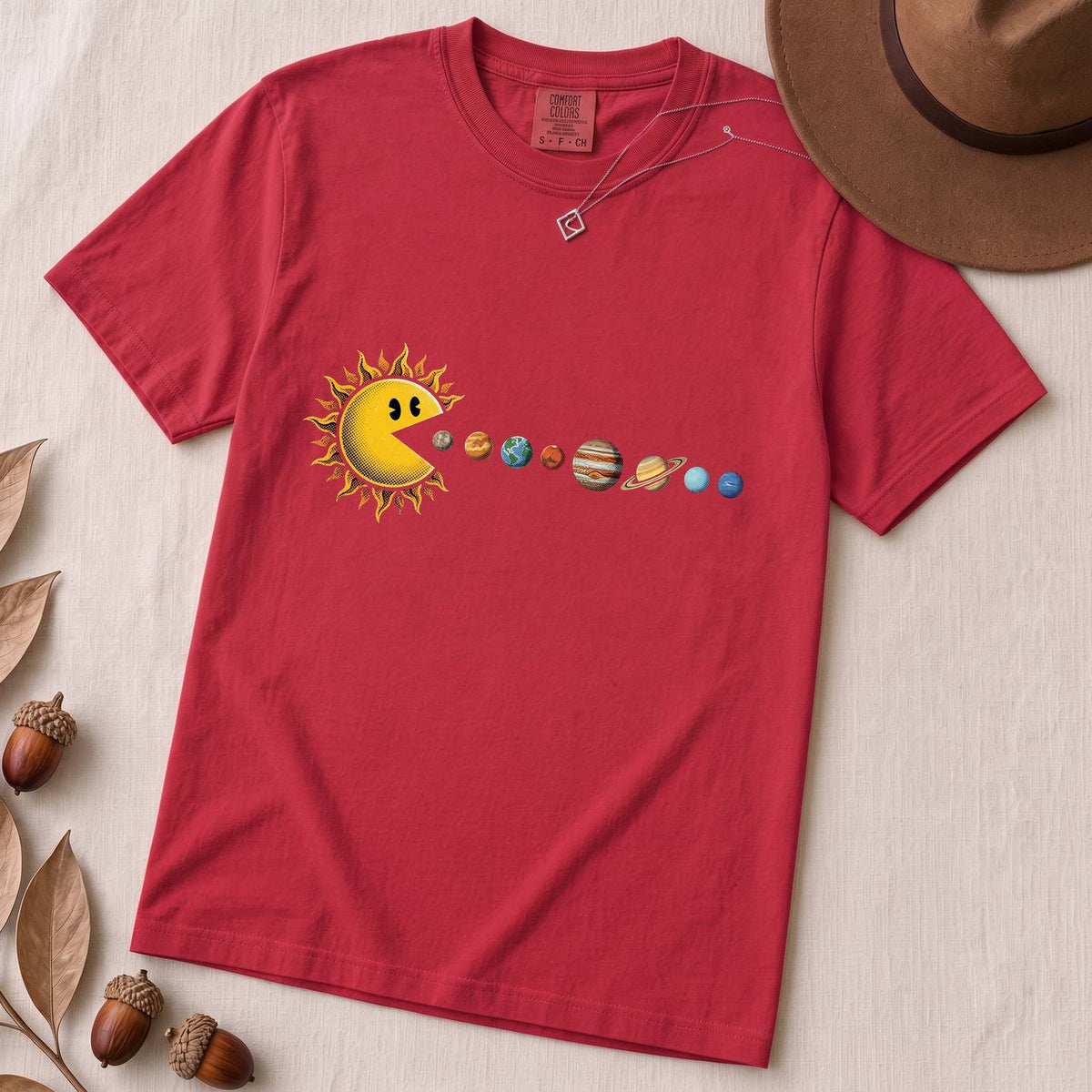 Cosmic Appetite - Sun Pac-Man Eating Planets - Unisex garment-dyed heavyweight t-shirt - Red unfolded t-shirt mockup