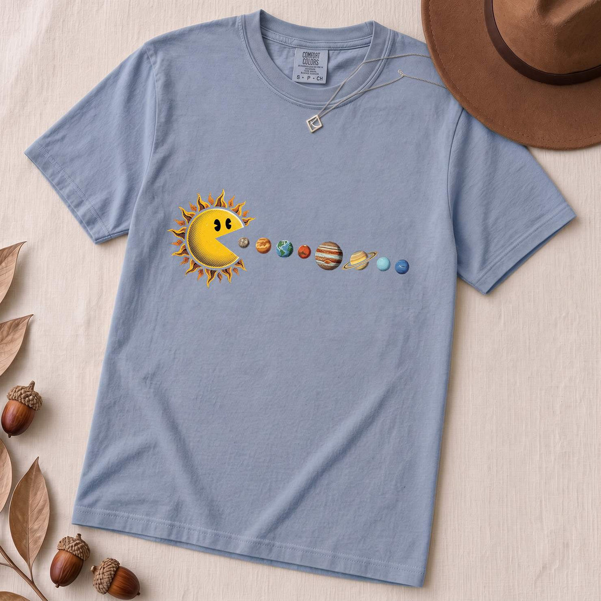 Cosmic Appetite - Sun Pac-Man Eating Planets - Unisex garment-dyed heavyweight t-shirt - Washed Denim unfolded t-shirt mockup