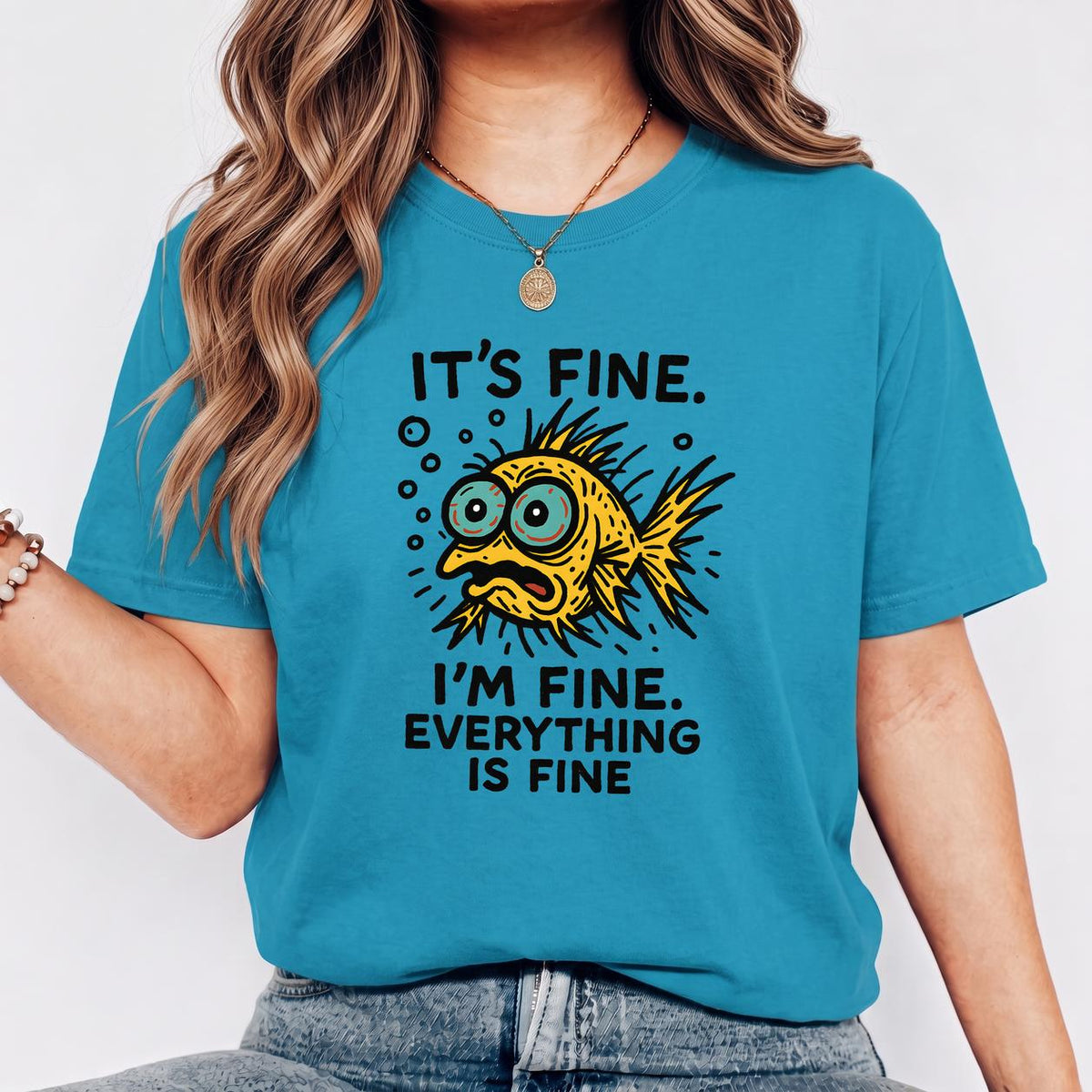 Funny Fish “It’s Fine” Mental Health Humor Sarcastic Panic Meme Tee - Aqua on-model t-shirt mockup