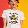 Woman wearing a white t-shirt with a fish graphic and text against a colorful background