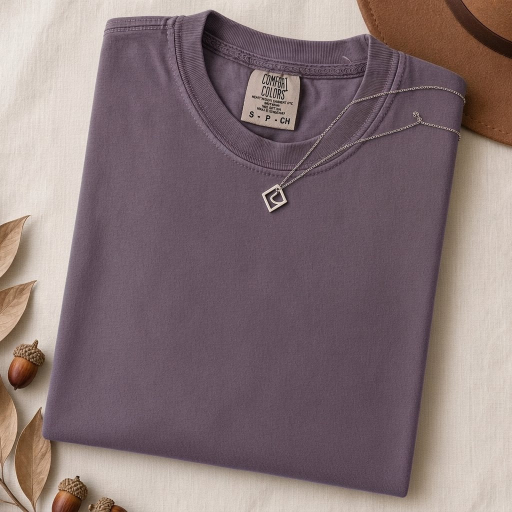 Just a t-shirt. Comfort Colors unisex garment-dyed heavyweight plain t-shirt with Radiant Art logo on right sleeve - Grape folded t-shirt mockup