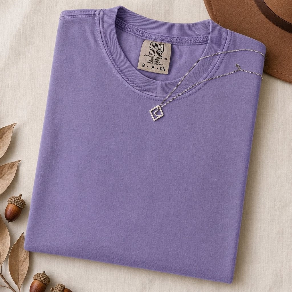 Just a t-shirt. Comfort Colors unisex garment-dyed heavyweight plain t-shirt with Radiant Art logo on right sleeve - Violet folded t-shirt mockup