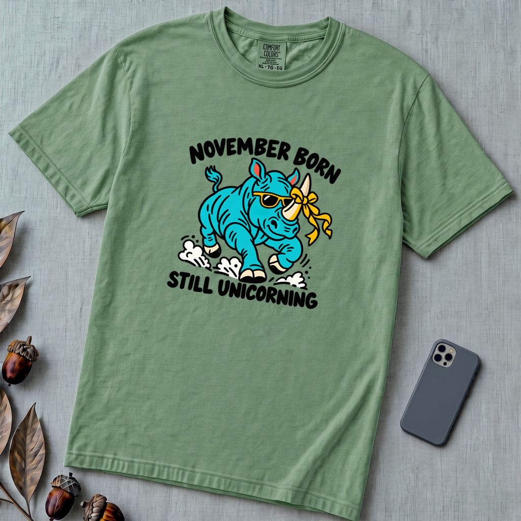 November Born Still Unicorning T-Shirt, Funny Rhino Birthday Tee - Light Green unfolded t-shirt mockup