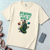 Reading Is Out of This World - Astronaut & Alien Reader T-Shirt - Ivory unfolded t-shirt mockup