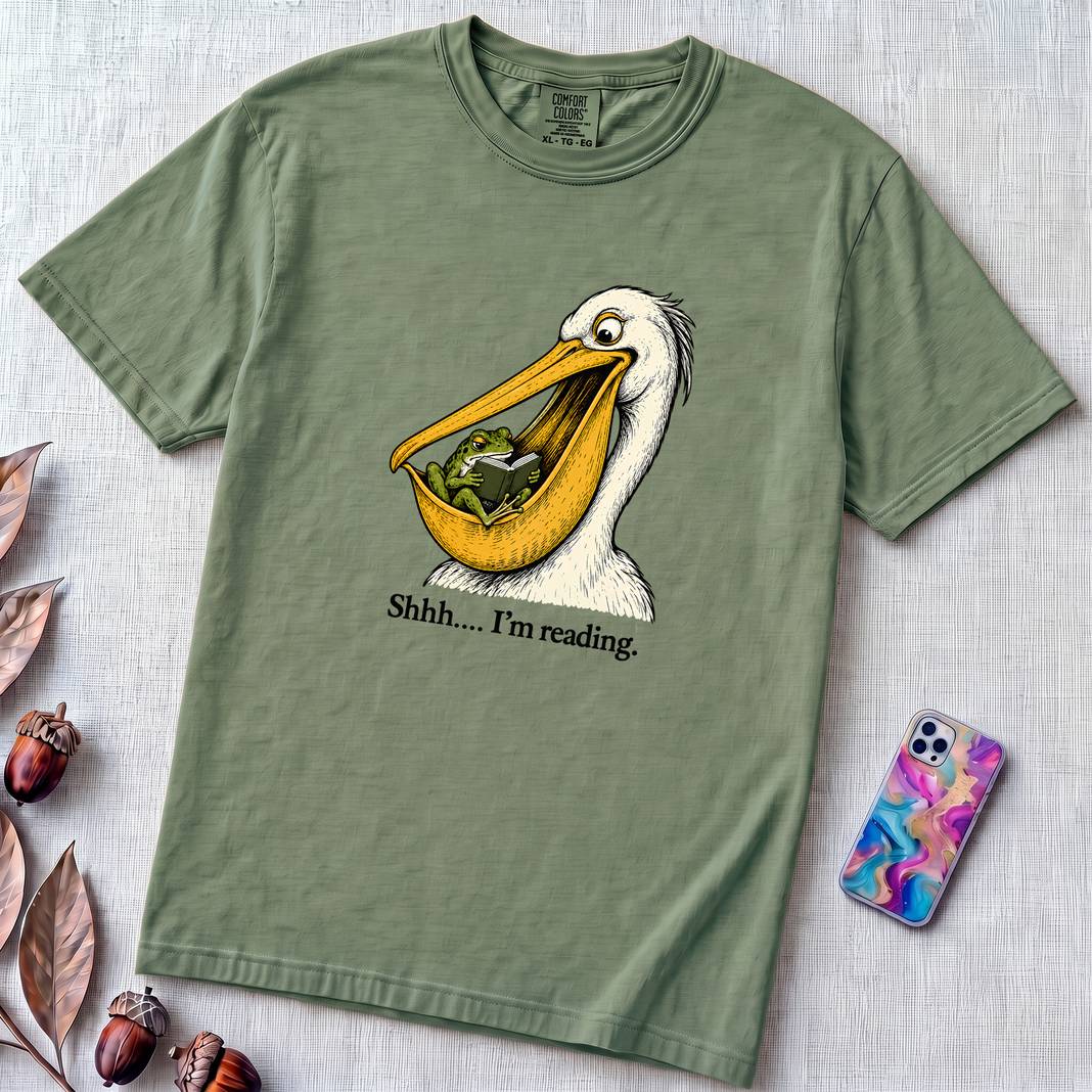Shhh… I’m Reading Pelican Frog T-Shirt - Light Green unfolded t-shirt mockup