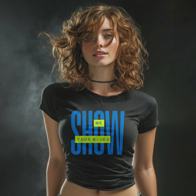 Woman wearing a black t-shirt with blue and yellow text "show me your books" against a dark background