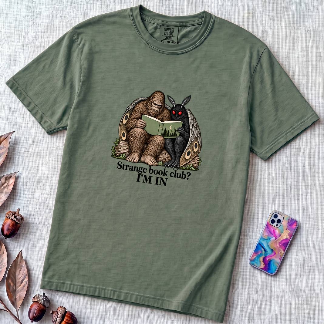 Strange Book Club? I’m In,  Funny Cryptid T-Shirt, Bigfoot and Mothman are reading - Blue Spruce unfolded t-shirt mockup