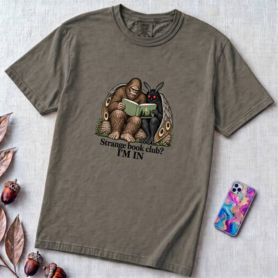 Strange Book Club? I’m In,  Funny Cryptid T-Shirt, Bigfoot and Mothman are reading - Pepper unfolded t-shirt mockup