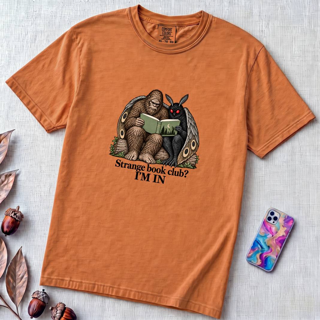 Strange Book Club? I’m In,  Funny Cryptid T-Shirt, Bigfoot and Mothman are reading - Yam unfolded t-shirt mockup