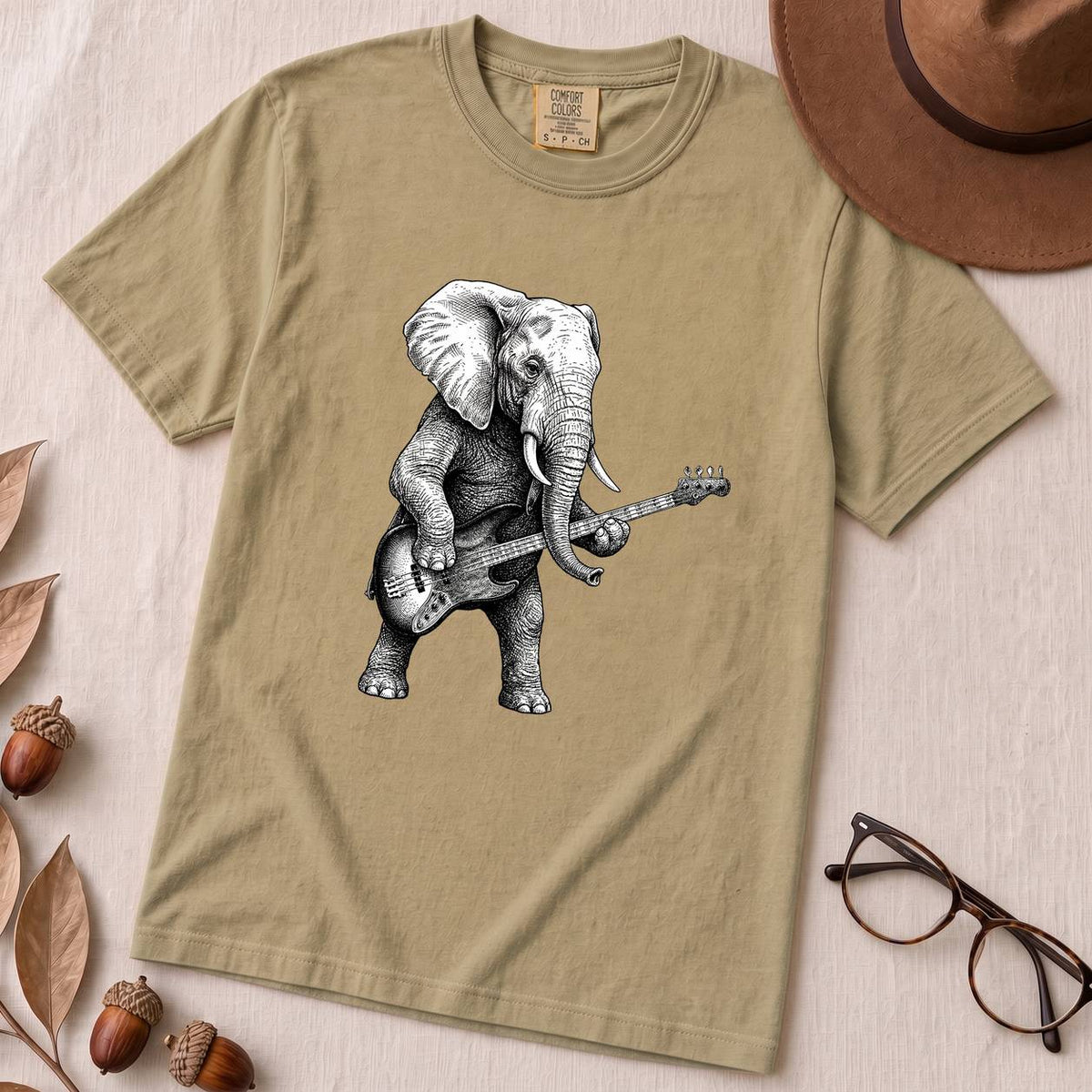 "The Heavy Rhythm" Elephant Bassist Graphic T-shirt - Khaki unfolded t-shirt mockup