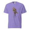 Purple t-shirt with a Spinosaurus mirabilis graphic and a plush toy on a white background