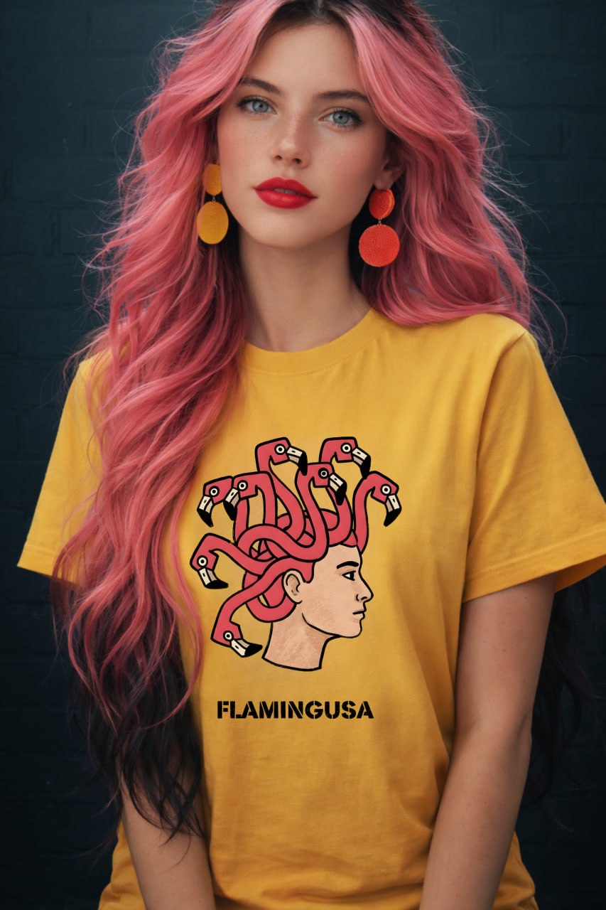 Woman with long pink hair wearing a yellow Flamingusa t-shirt featuring a flamingo Medusa graphic design